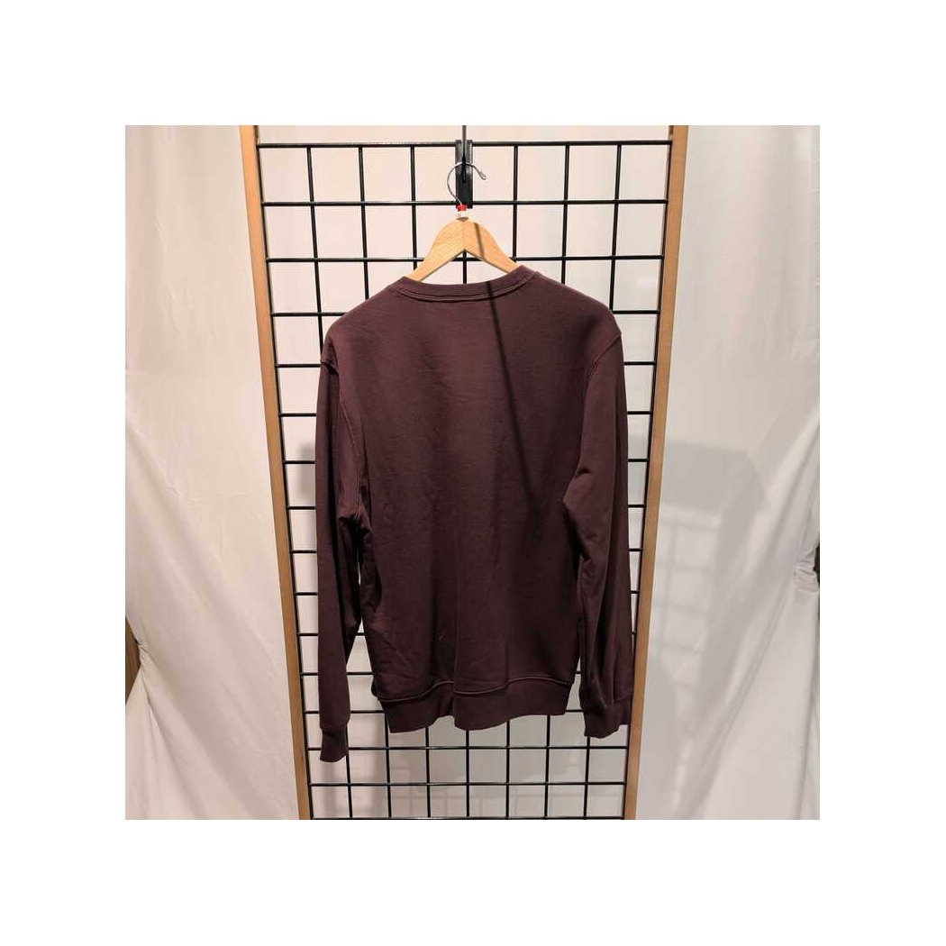 Back view of the Prana Mens Everyday Crew Sweatshirt-SAMPLE in DeepVino hanging on a wooden hanger against a grid wall.
