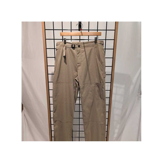Front view of the Prana Mens Stretch Zion Carpenter Pant-SAMPLE in Sandbar/32 hanging on a wooden hanger against a grid background.