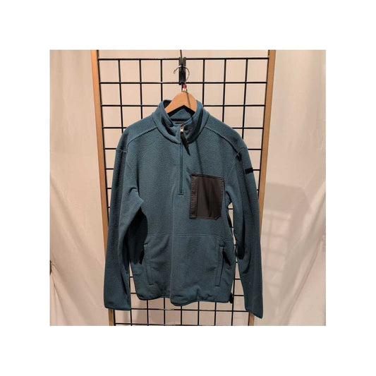 Blue Coral Prana Mens Stretch Zion Fleece 1/4 Zip-SAMPLE hangs on a wooden hanger against a grid backdrop.