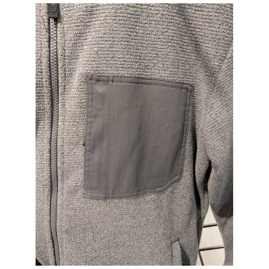 Close-up of the Prana Mens Stretch Zion Fleece FZ Hoodie-SAMPLE in Shadow Heather showing the zippered front and chest pocket.