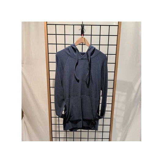 Front view of the Prana Mens Touchstone Hoodie-SAMPLE in BluffBlueHeathe hanging on a wooden hanger against a grid wall.