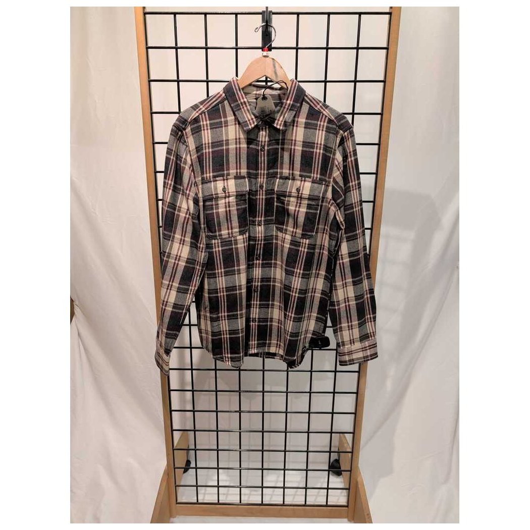 Front view of the Prana Mens Westbrook Flannel Shirt-SAMPLE in Deep Vino hanging on a grid display with a wooden frame.