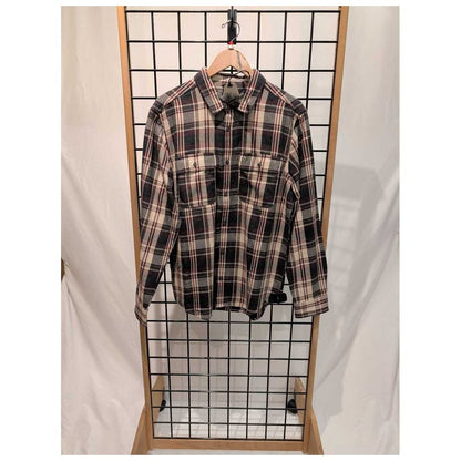 Front view of the Prana Mens Westbrook Flannel Shirt-SAMPLE in Deep Vino hanging on a grid display with a wooden frame.