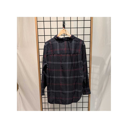 Back view of the Prana Womens Cabin Core Flannel-SAMPLE in Nautical hanging on a wooden hanger against a grid wall.