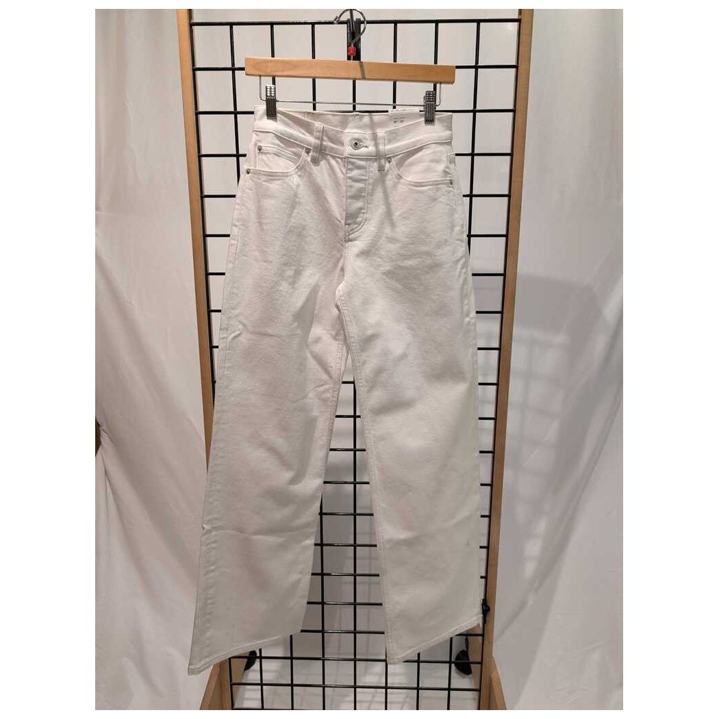 Front view of the Prana Womens Carlsbad 760 Wid Leg 26' -SAMPLE in WhiteSand/26' 32 hanging on a grid display with a wooden hanger.