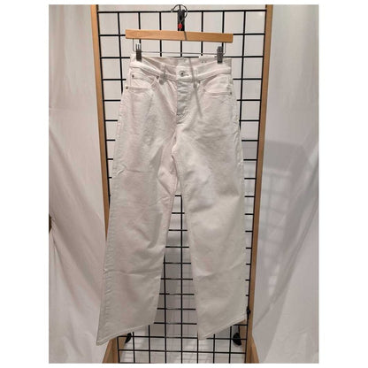 Front view of the Prana Womens Carlsbad 760 Wid Leg 26' -SAMPLE in WhiteSand/26' 32 hanging on a grid display with a wooden hanger.