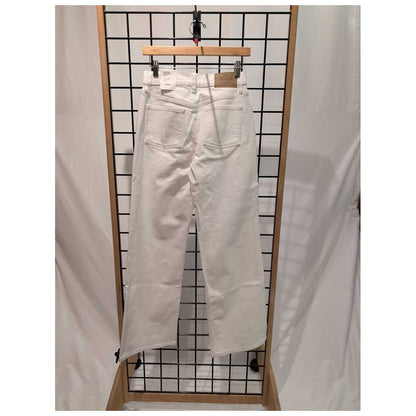 Back view of the Prana Womens Carlsbad 760 Wid Leg 26' -SAMPLE in WhiteSand/26' 32 hanging on a grid display with a wooden hanger.