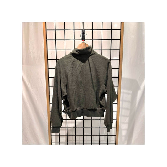 Back view of the Prana Womens Cozy Up Full Zip-SAMPLE in Nori hanging on a grid display with a white backdrop.