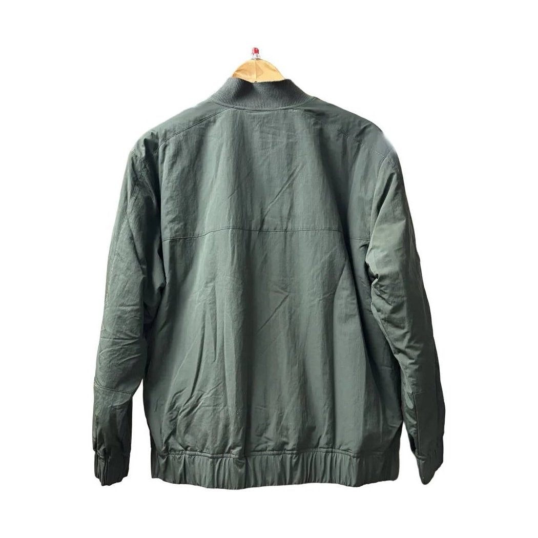 Back view of the Prana Womens Encinitas Bomber Jacket-SAMPLE in Nori hanging on a wooden hanger against a white background.