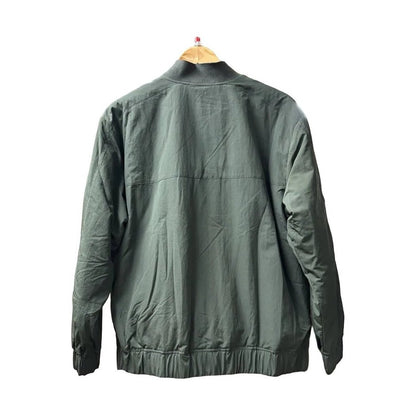 Back view of the Prana Womens Encinitas Bomber Jacket-SAMPLE in Nori hanging on a wooden hanger against a white background.