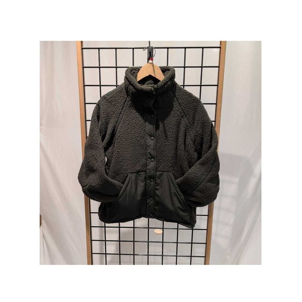 Front view of the Prana Womens Encinitas Sherpa Jacket-SAMPLE in Nori hanging on a wooden hanger against a grid background.
