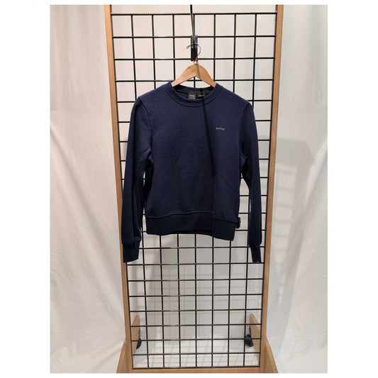 Navy Prana Womens Everyday Crew Sweatshirt-SAMPLE hangs on a wooden hanger against a grid display with a white backdrop.