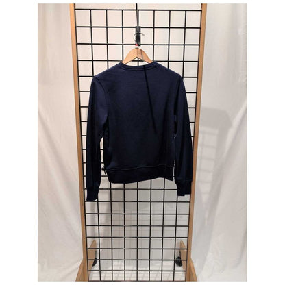 Back view of the Prana Womens Everyday Crew Sweatshirt-SAMPLE in Canvas hanging on a wooden hanger against a grid background.