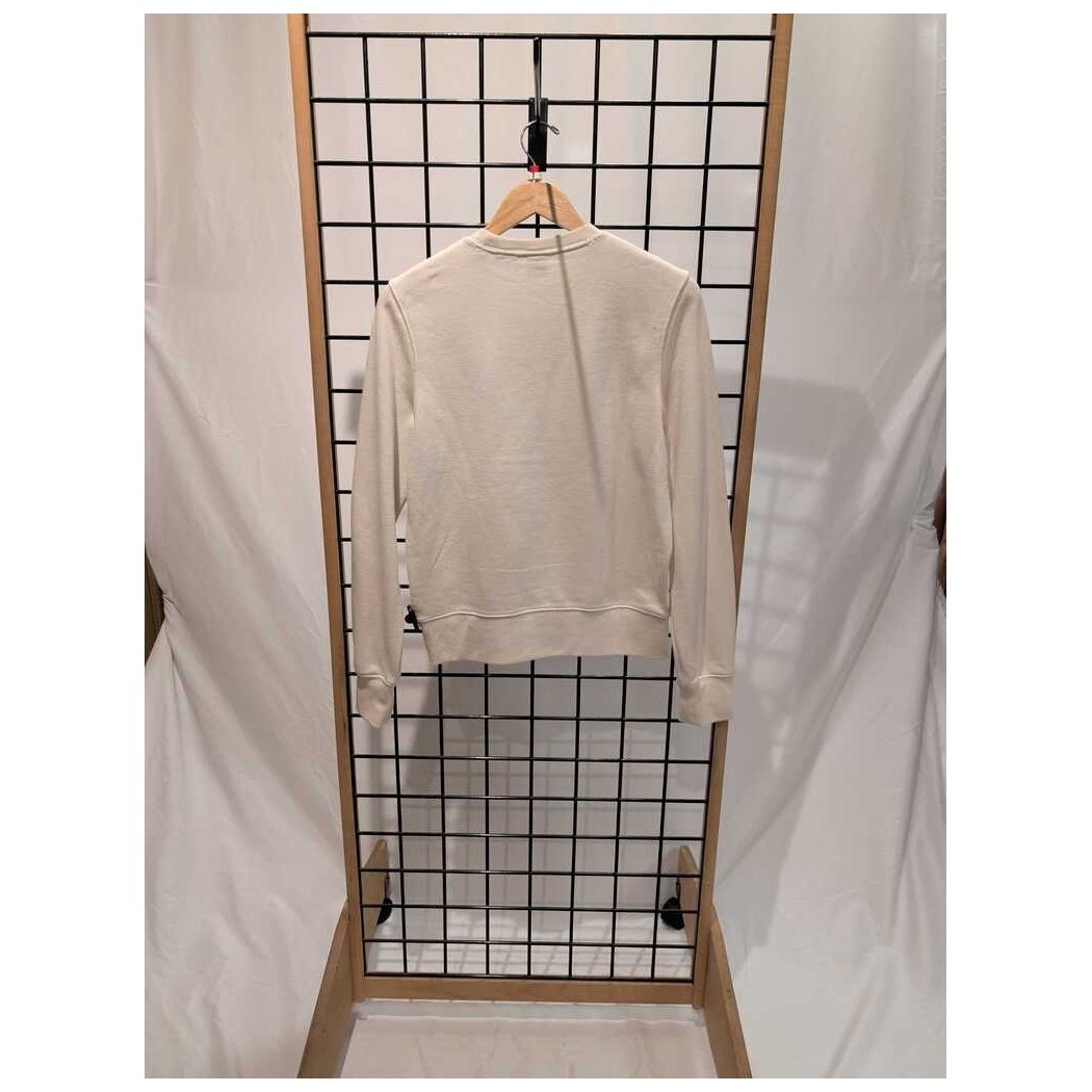 Back view of the Prana Womens Everyday Crew Sweatshirt-SAMPLE in Canvas hanging on a wooden hanger against a grid background.