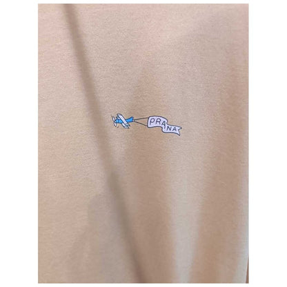 Close-up of the Prana Womens Everyday Graphic Oversized Tee-SAMPLE in Dijon Vacation showing the small airplane graphic on the fabric.