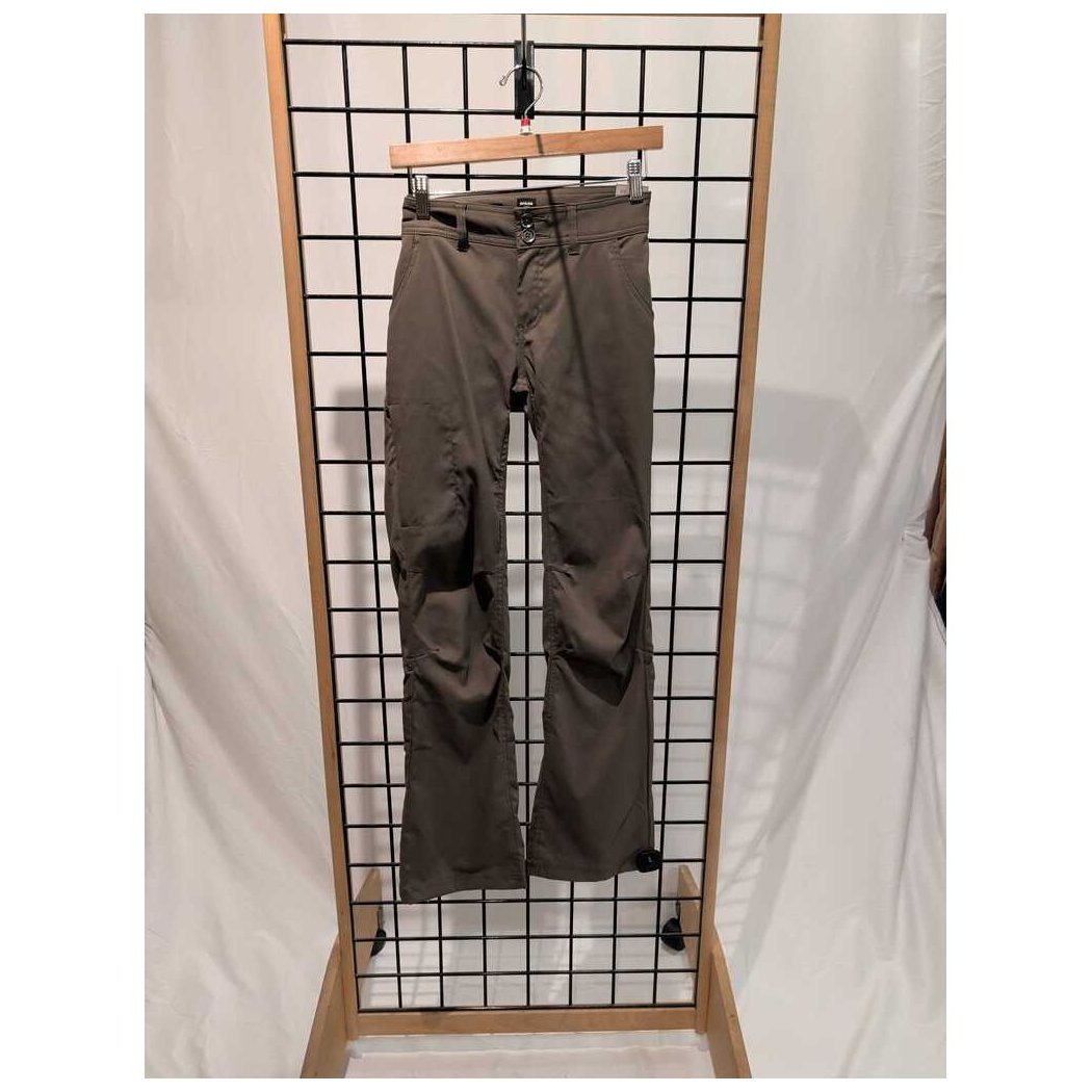 Front view of the Prana Womens Halle Pant-SAMPLE in Slate Green hanging on a grid display with a wooden hanger.