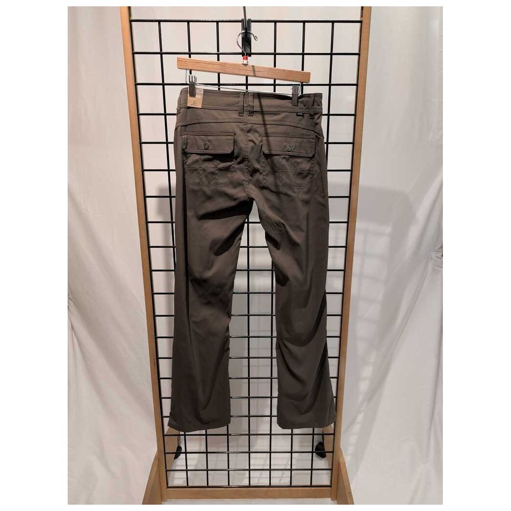 Back view of the Prana Womens Halle Pant-SAMPLE in Slate Green hanging on a grid display with a wooden frame.