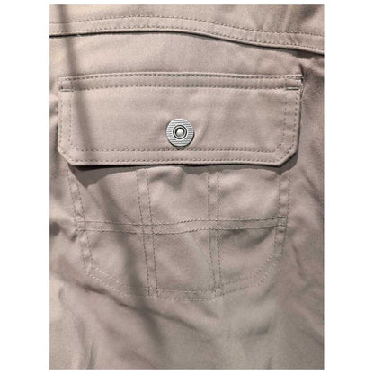 Close-up of the Prana Womens Halle Pant-SAMPLE in Slate Green showing the back pocket with a metal snap and stitched details.