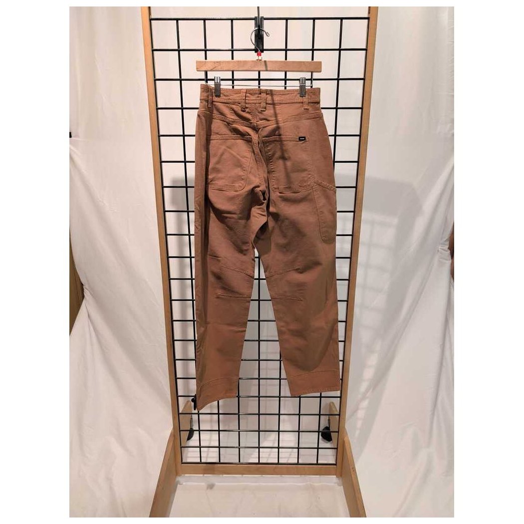 Front view of the Prana Womens Rock Ridge Carpenter Pant-SAMPLE in Almond hanging on a grid display with a white backdrop.