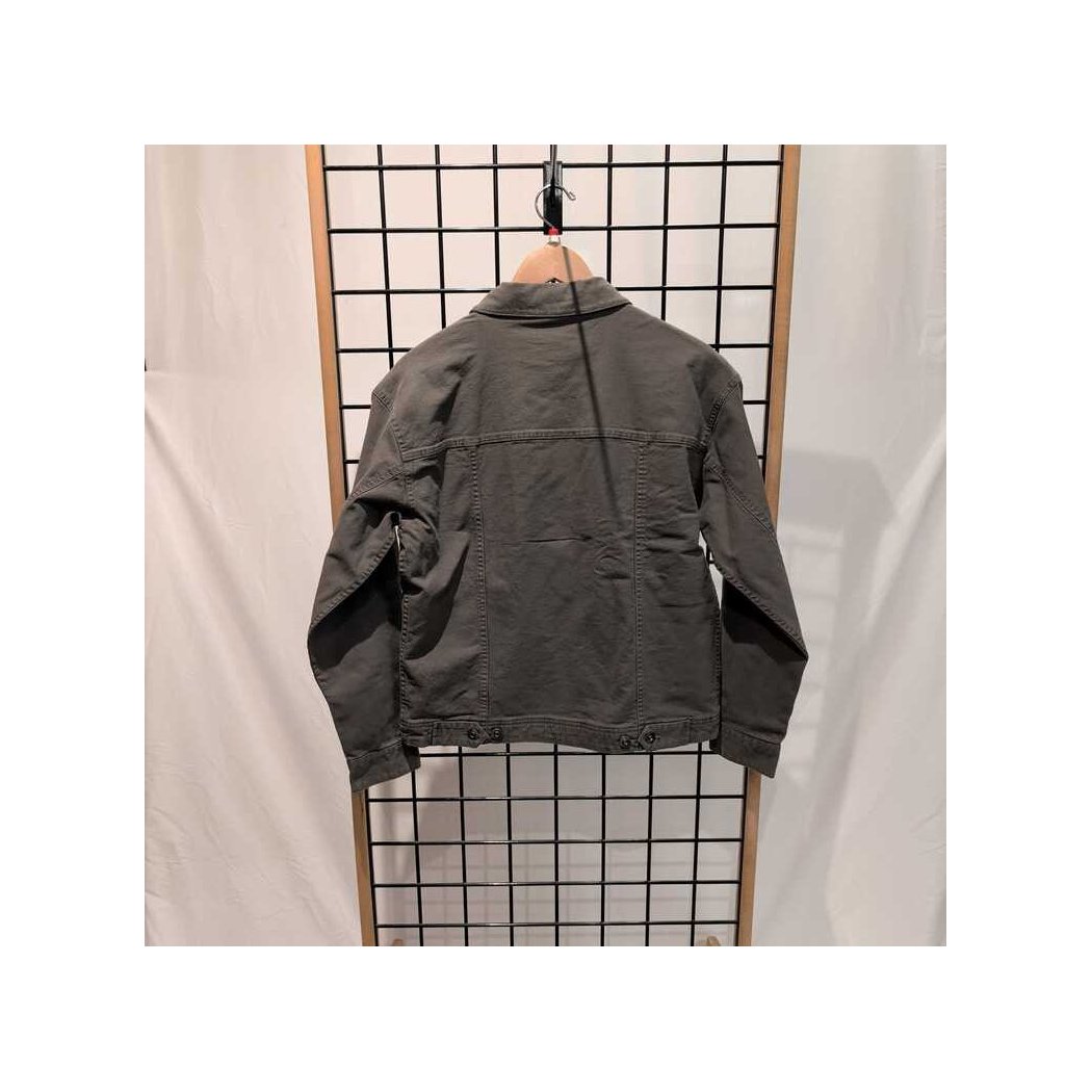 Back view of the Prana Womens Rock Ridge Jacket-SAMPLE in Thyme hanging on a grid display with a white backdrop.