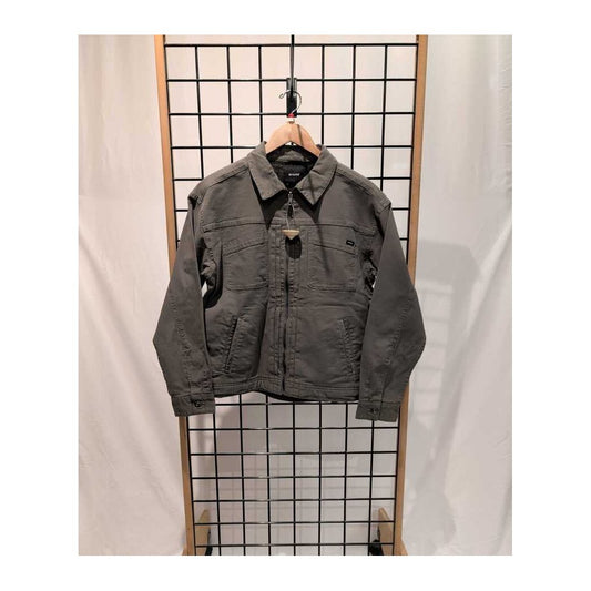 Front view of the Prana Womens Rock Ridge Jacket-SAMPLE in Thyme hanging on a grid display with a white backdrop.