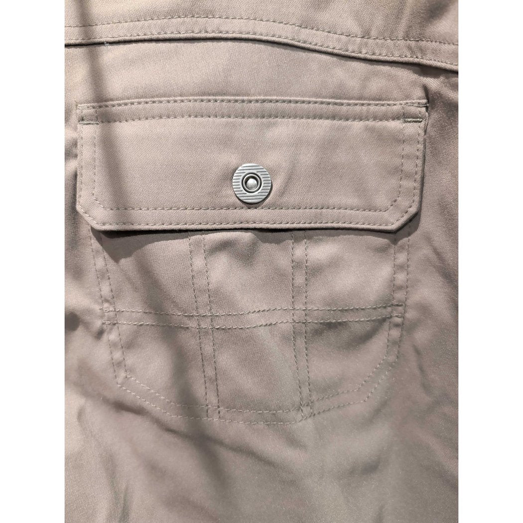 Close-up of the Prana Womens Stretch Zion Mid Rise Pant-SAMPLE in Mud showing the back pocket with a metal snap and stitched details.