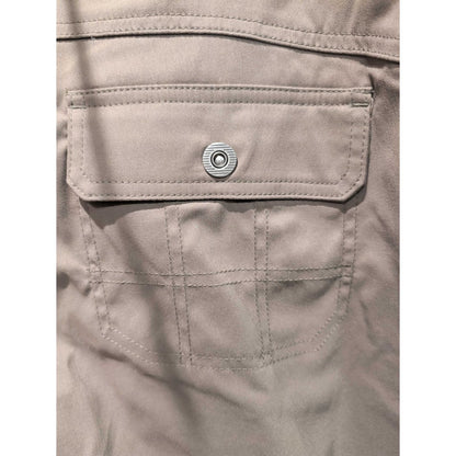 Close-up of the Prana Womens Stretch Zion Mid Rise Pant-SAMPLE in Mud showing the back pocket with a metal snap and stitched details.