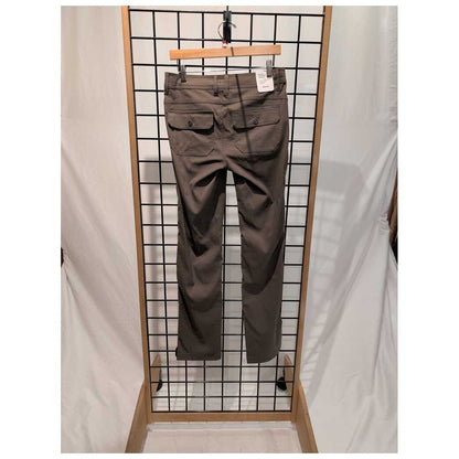 Back view of the Prana Womens Stretch Zion Mid Rise Pant-SAMPLE in Mud hanging on a grid display with a white backdrop.
