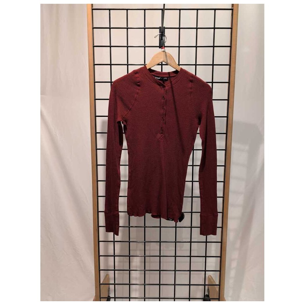 Front view of the Prana Womens Touchstone Henley-SAMPLE in RetrograHeather hanging on a wooden hanger against a grid display.