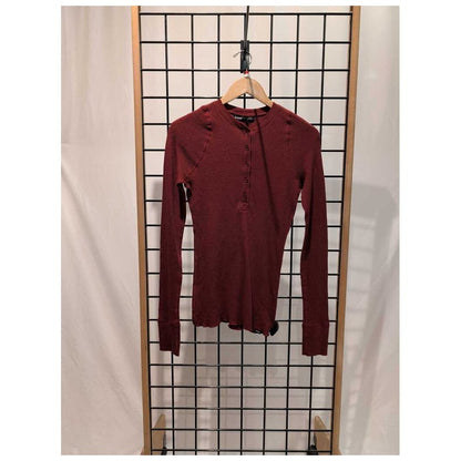 Front view of the Prana Womens Touchstone Henley-SAMPLE in RetrograHeather hanging on a wooden hanger against a grid display.