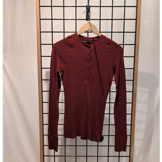 Front view of the Prana Womens Touchstone Henley-SAMPLE in RetrograHeather hanging on a wooden hanger against a grid display.
