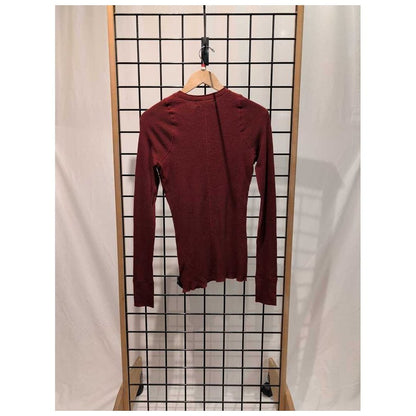 Back view of the Prana Womens Touchstone Henley-SAMPLE in RetrograHeather hanging on a grid display with a white backdrop.