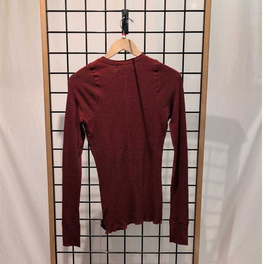 Back view of the Prana Womens Touchstone Henley-SAMPLE in RetrograHeather hanging on a grid display with a white backdrop.