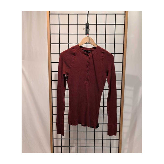 Front view of the Prana Womens Touchstone Henley-SAMPLE in RetrograHeather hanging on a wooden hanger against a grid background.