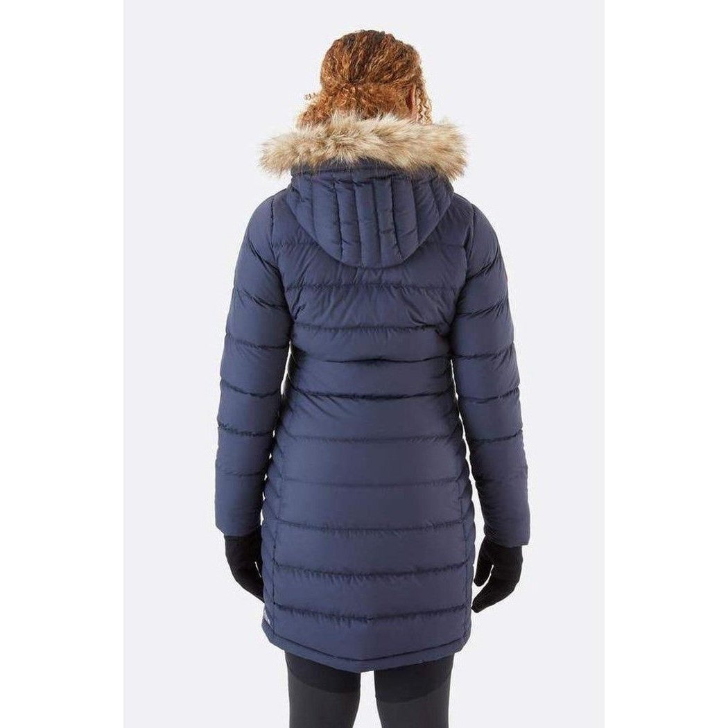 Back view of the Rab Women's Deep Cover Parka in Army showing the fur-lined hood and black gloves against a white background.