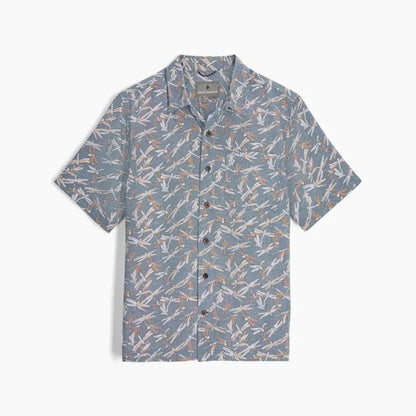 A front view of the Royal Robbins Men's Camino Pucker Short Sleeve in Freshwater Botanist Pt with a light blue background.