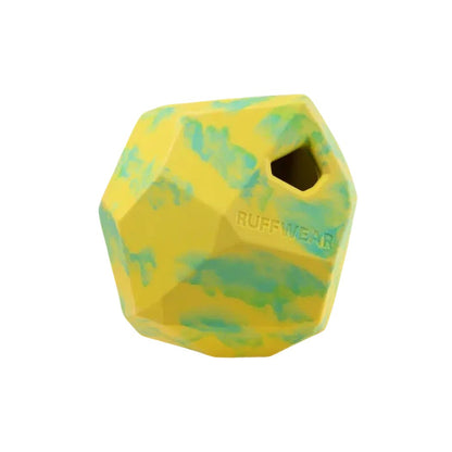 A top-down view of the Ruffwear Gnawt-a-rock in Dandelion Yellow with a hole and the brand name visible against a white background.