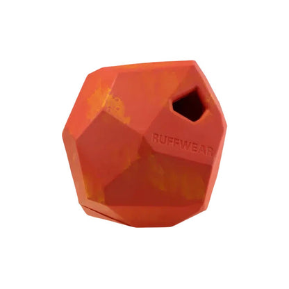 A front view of the Ruffwear Gnawt-a-rock in Dandelion Yellow showing the textured surface and a small hole on the top.