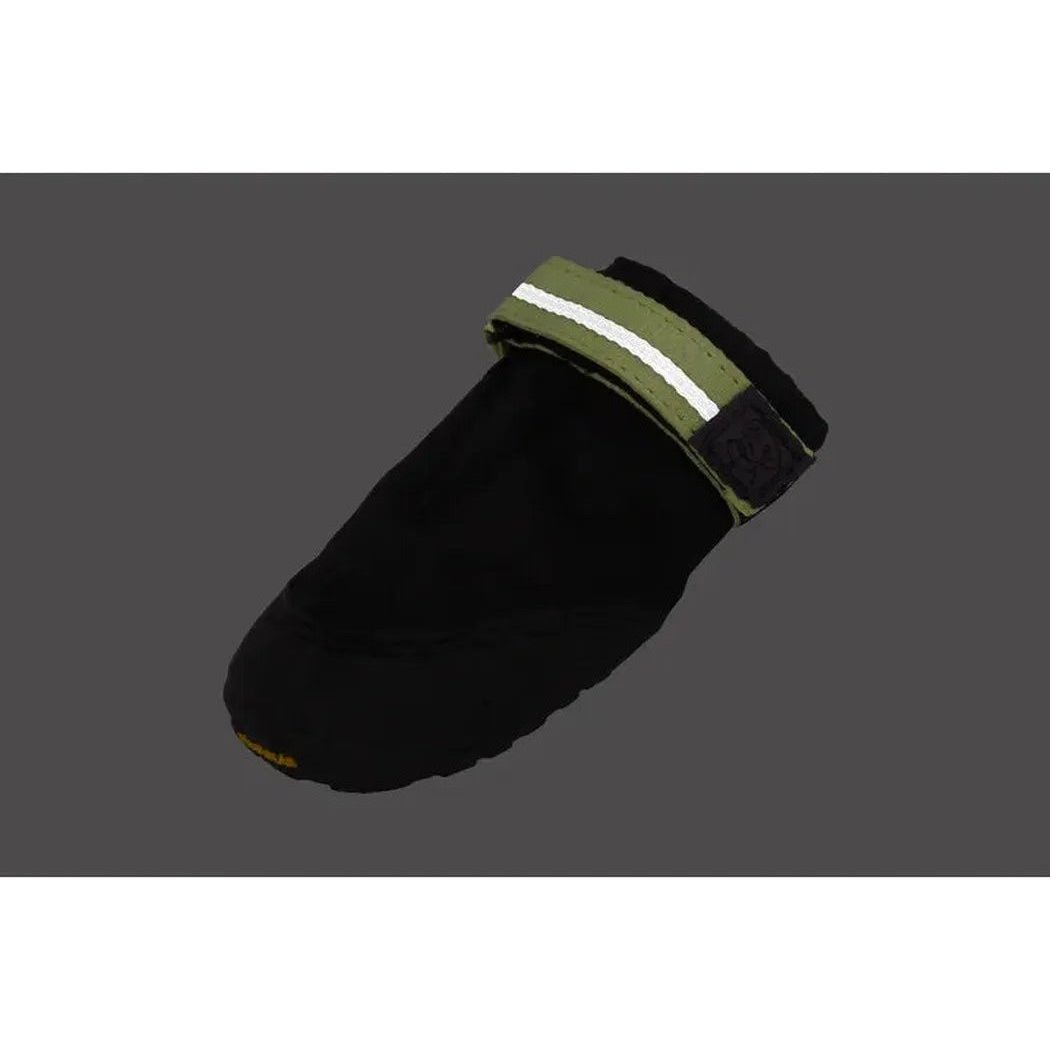 A side view of the Ruffwear Summit Trex Shoes in Obsidian Black showing the reflective strap against a dark gray background.