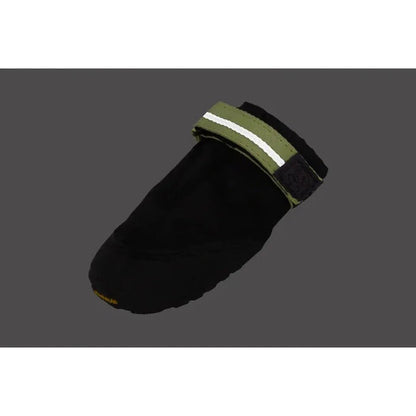 A side view of the Ruffwear Summit Trex Shoes in Obsidian Black showing the reflective strap against a dark gray background.