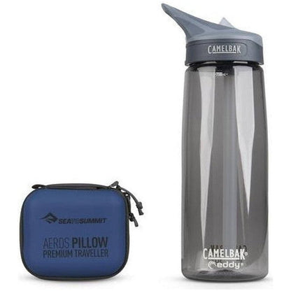 A blue Sea To Summit Aeros Pillow Premium Traveller case sits next to a charcoal CamelBak water bottle on a white background.