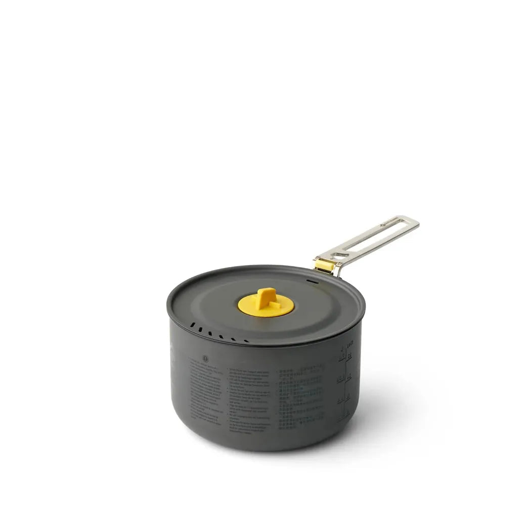 A black Sea To Summit Frontier UL Pot - 1.3L with a yellow lid knob and metal handle, photographed from a front angle against a white background.