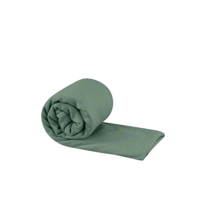 A rolled Sea To Summit Pocket Towel in Baltic Blue lies on a white background.