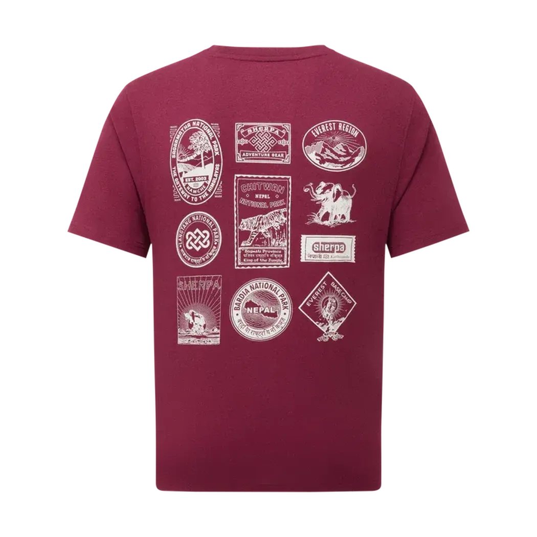 Back view of the Sherpa Adventure Gear Men's Jutnu Badge Tee in Wine showing various white badges on the back against a white background.