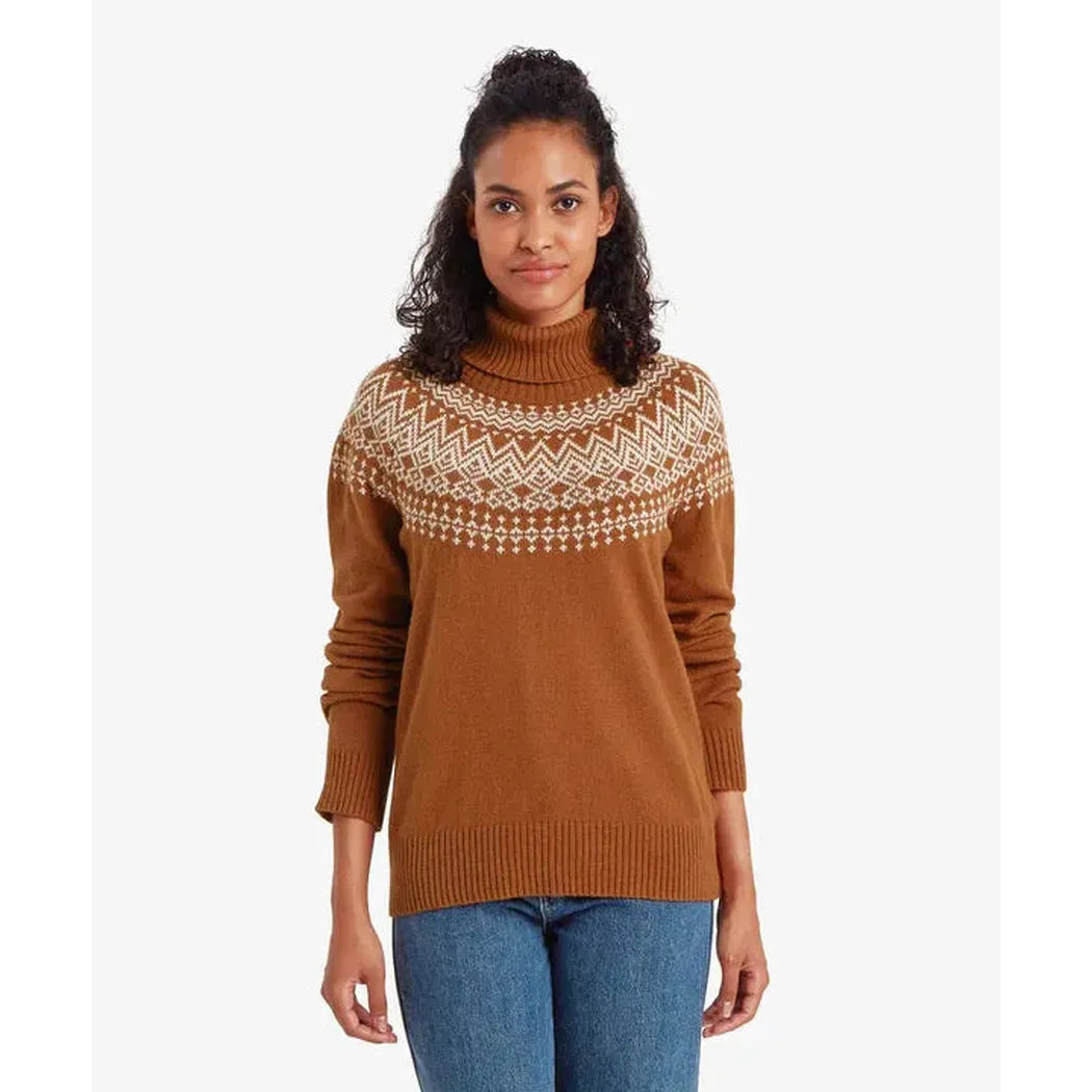 A front view of the Sherpa Adventure Gear Women's Camkilo Roll Neck Sweater in Mocha on a model wearing blue jeans against a white background.