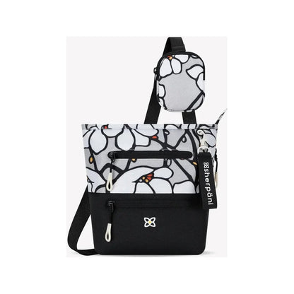 A front view of the Sherpani Sadie with Strap Pocket in Desert showing the front pocket and attached strap pouch against a white background.