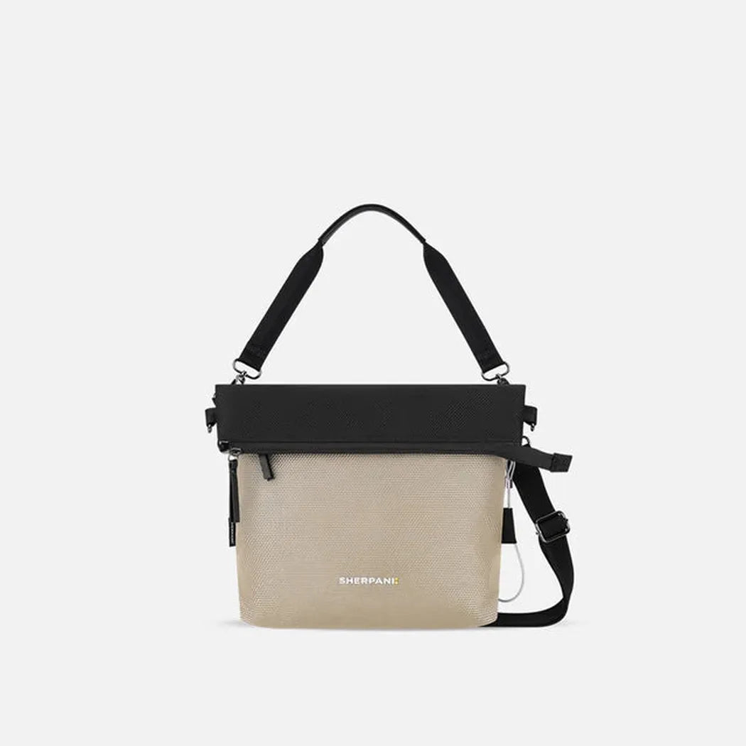 A front view of the Sherpani Vale AT bag in Aloe Mist with a black top and shoulder strap against a white background.