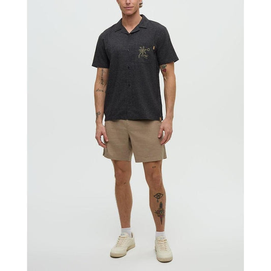 A model wearing the Tentree Men's Chambers Pocket Shirt in Meteorite Black/Khaki stands against a plain white background.