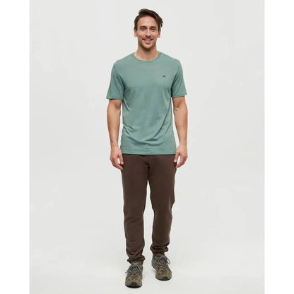 A front view of the Tentree Men's TreeFleece Atlas Sweatpant in Kona, showing a model wearing it against a plain white background.