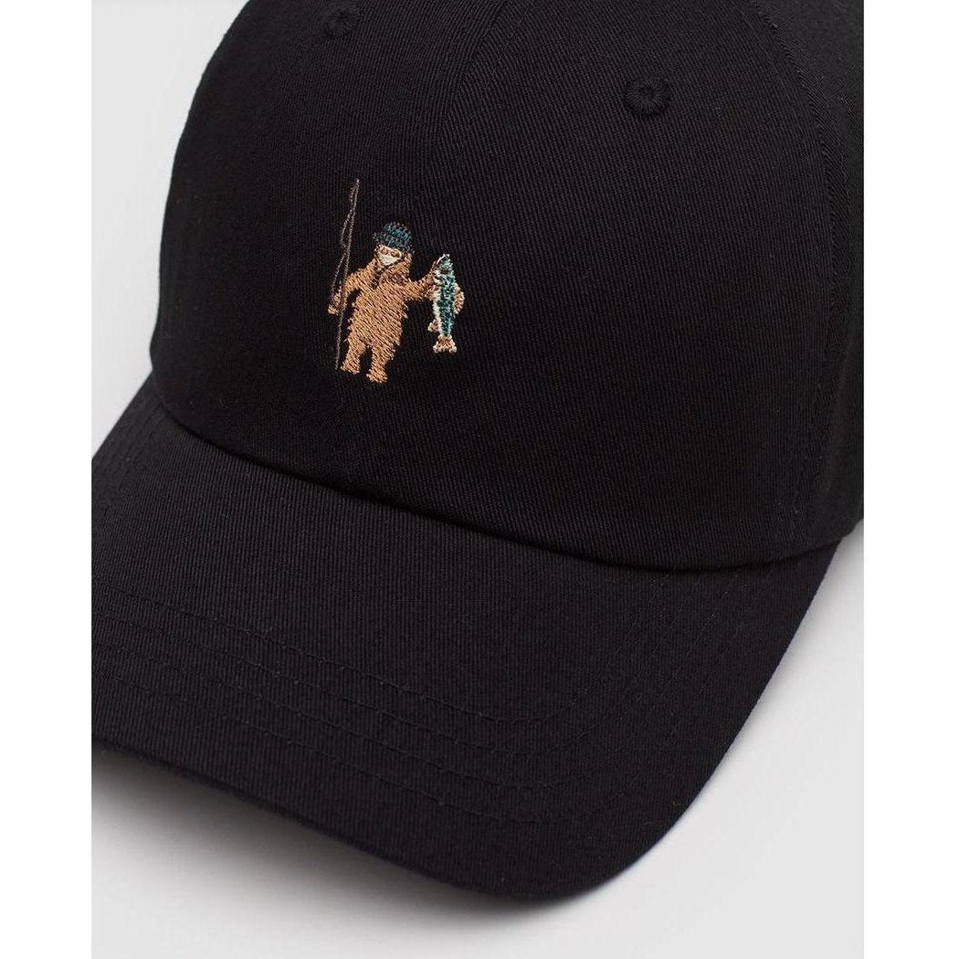 A black Tentree Sasquatch Peak Hat with a brown Sasquatch embroidery on the front, shown from a front angle against a white background.